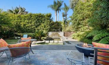 Backyard complete with Firepit, koi pond, foundtain, and outdoor furniture