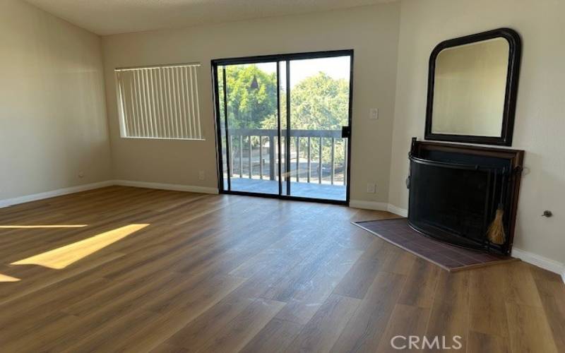 lLIVING ROOM UPSTAIRS WITH FIREPLACE AND BALCONY