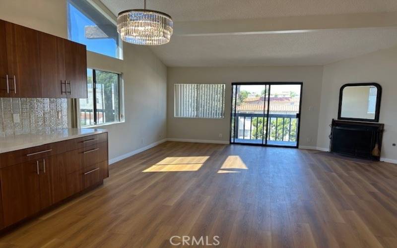 LIVING ROOM UPSTAIRS WITH BALCONY AND FIREPLACE