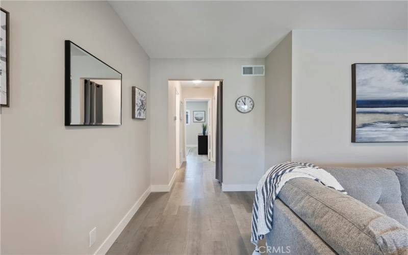 Hallway to two bedrooms and two bathrooms