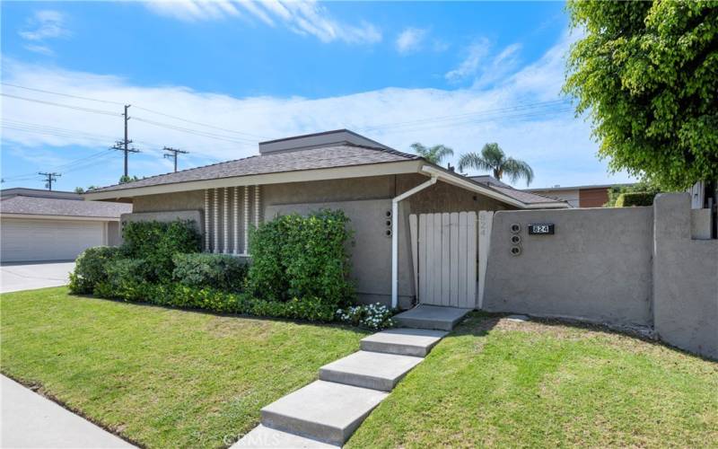 Entry to private backyard, up steps and through gate