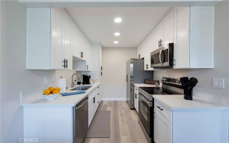 New shaker white cabinets with new stainless appliances