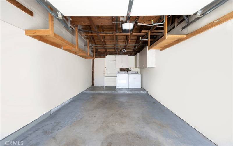 Newly painted single car garage with washer and dryer