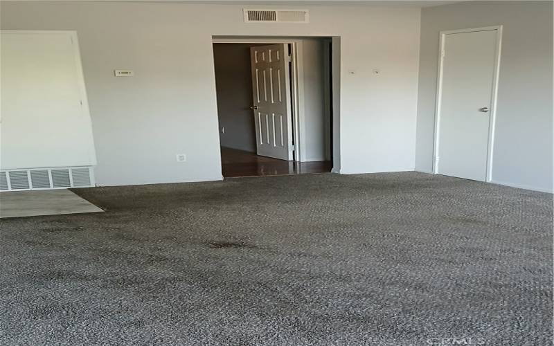 View of living room and hall closet