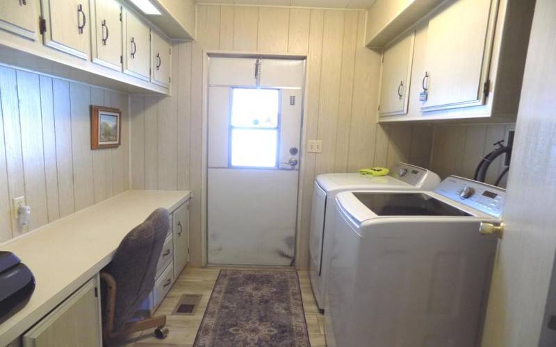 Laundry with desk and carport access