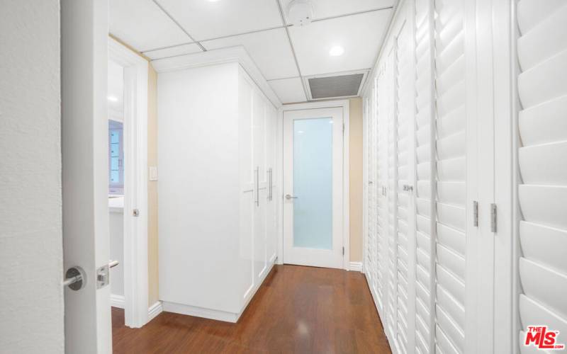 Laundry enclosed in cabinets