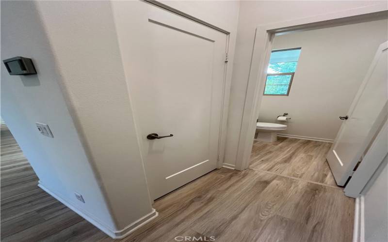 Powder room and closet are at the top of the stairs before entering the kitchen and great room.