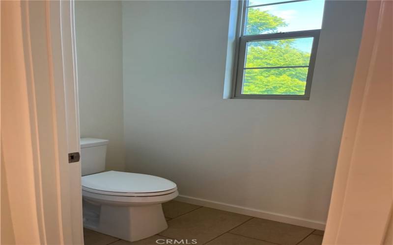 Even the master bathroom has green views!