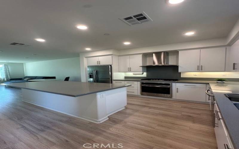 Plentiful counter space and a large kitchen island.