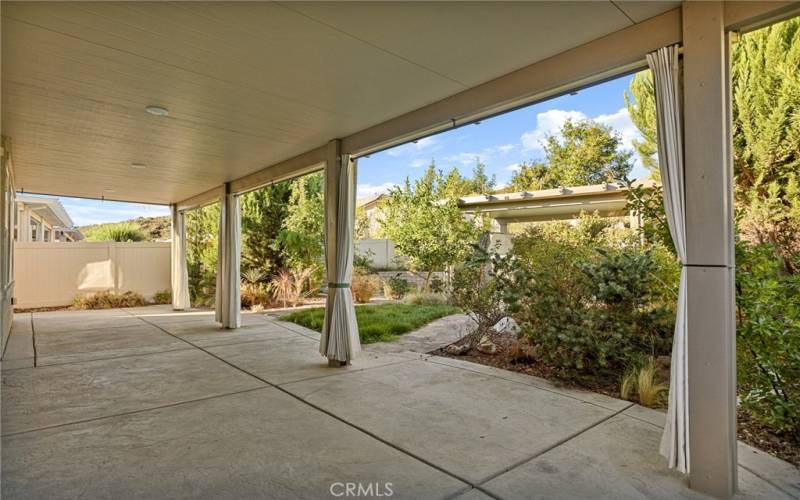 Huge Patio with outdoor curtains for entertainment