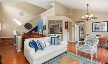 Open-concept living room, kitchen, and dining area.