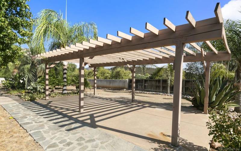 Beautiful, extravagant pergola. I visualize a long, narrow table with friends and family outside, enjoying a meal together.