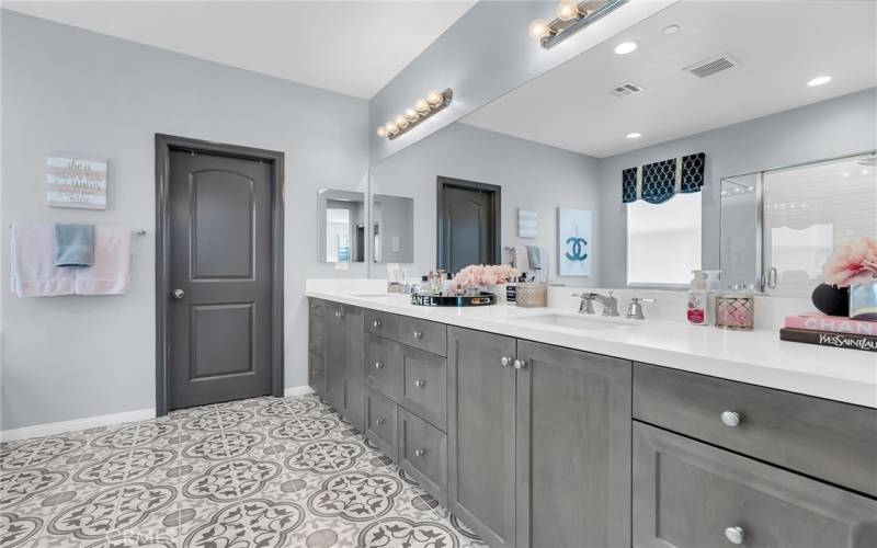 Primary bathroom with tiled flooring