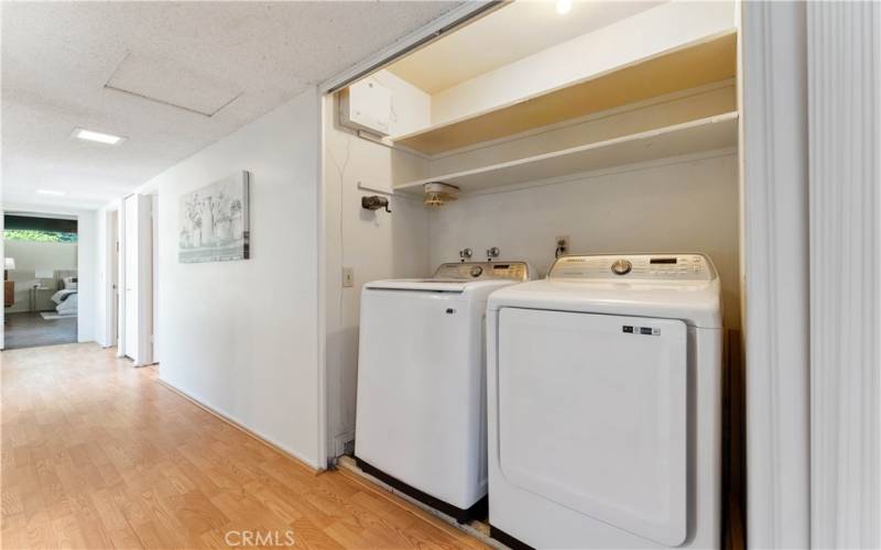 Laundry in closet between Primary bedroom and remaining bedrooms.