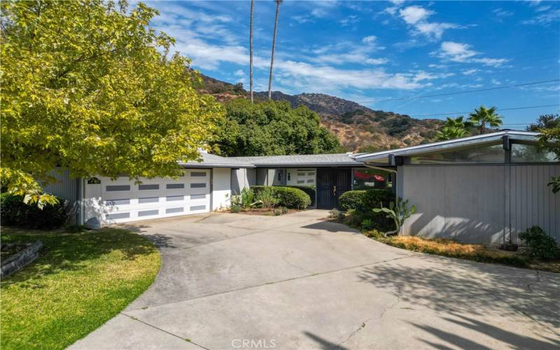 Mid Century home with 2 car garage. Door faces West.