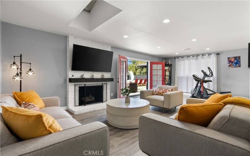 Open living room with a beautiful fireplace