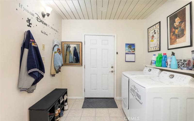 Laundry room with door to garage.