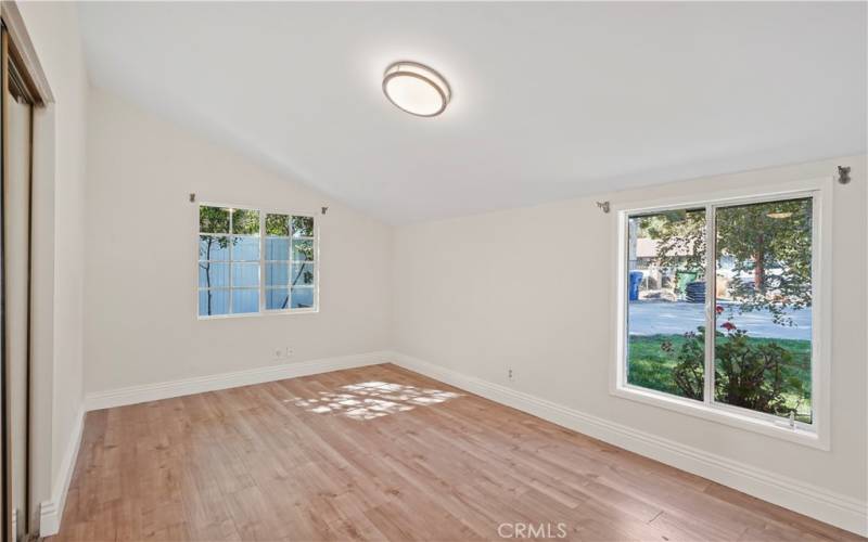 The ensuite bedroom overlooks the front yard with lots of greenery