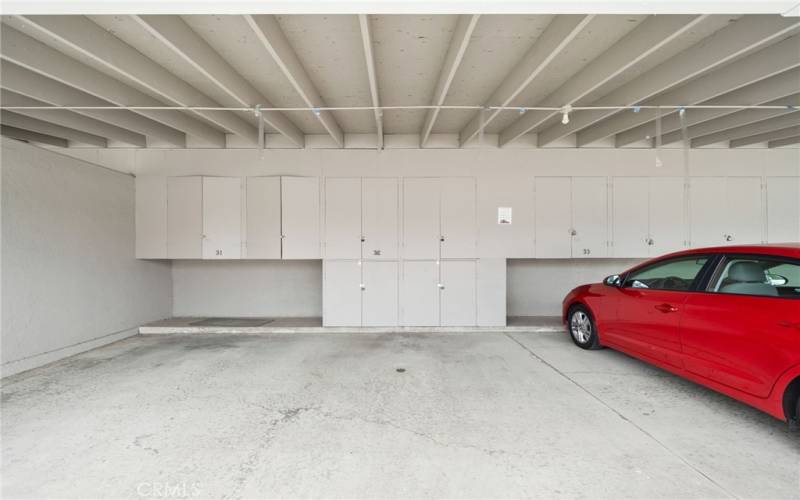 Carport with expanded cabinetry.