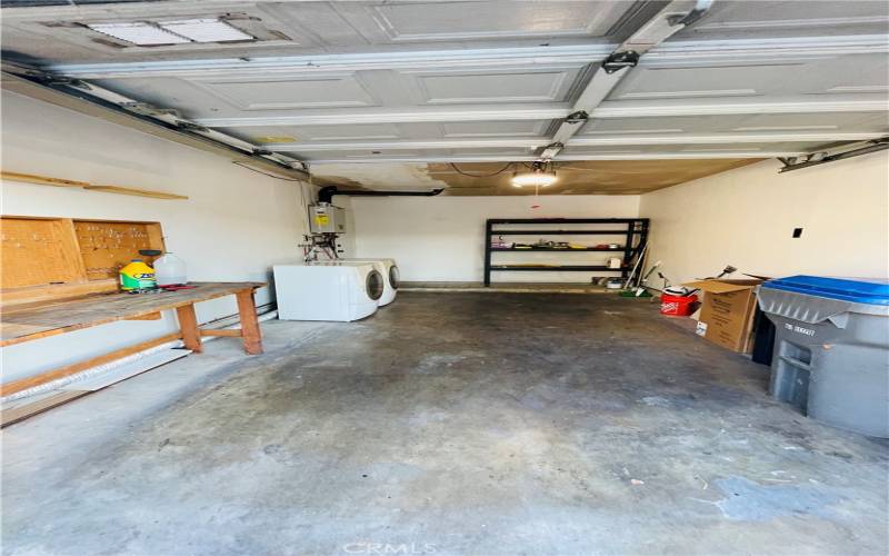 Black shelf in back of garage will be left for tenants use. Door to left of shelf is to enter the home