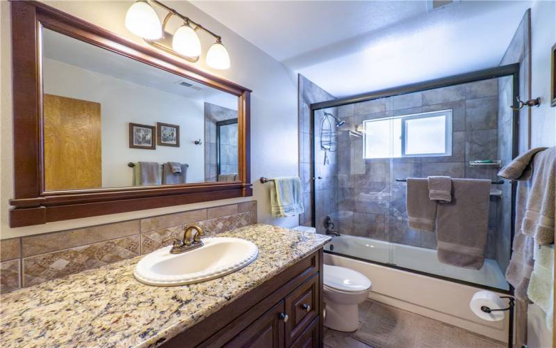 Guest Bathroom with tub/shower combination.