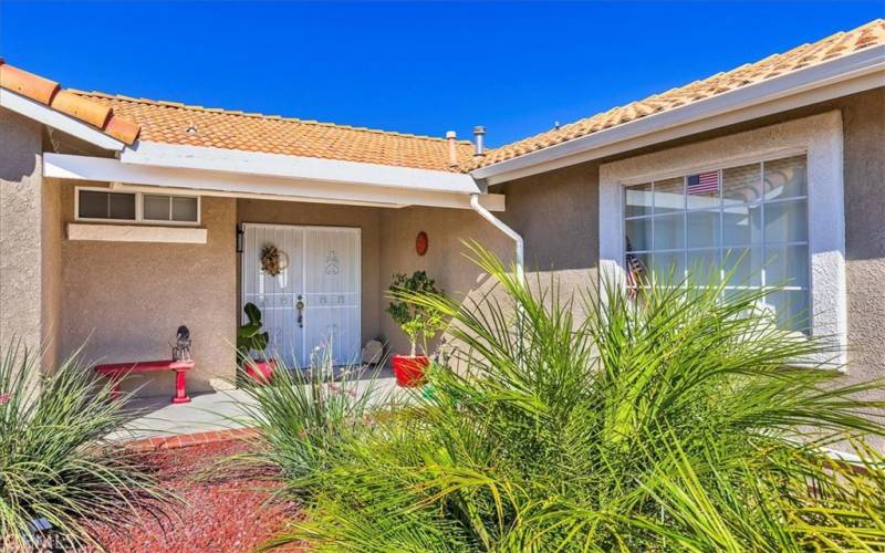 Front porch with double door entry and security door.