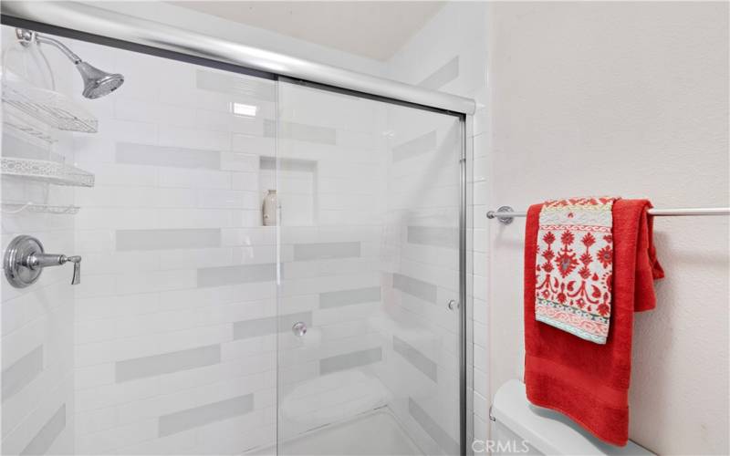 Primary bathroom with remodeled shower