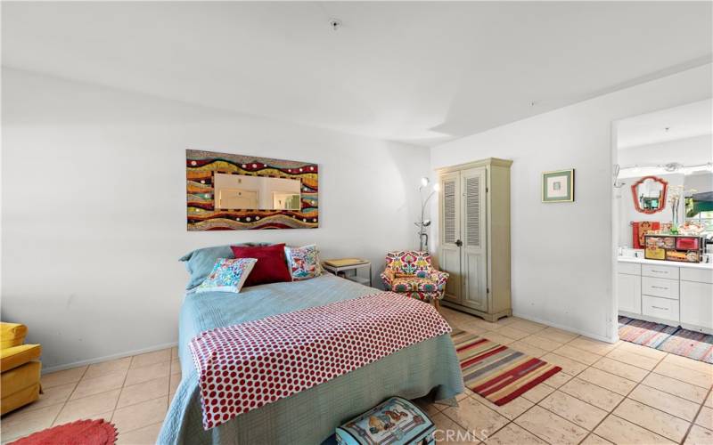 Primary bedroom with tile floors