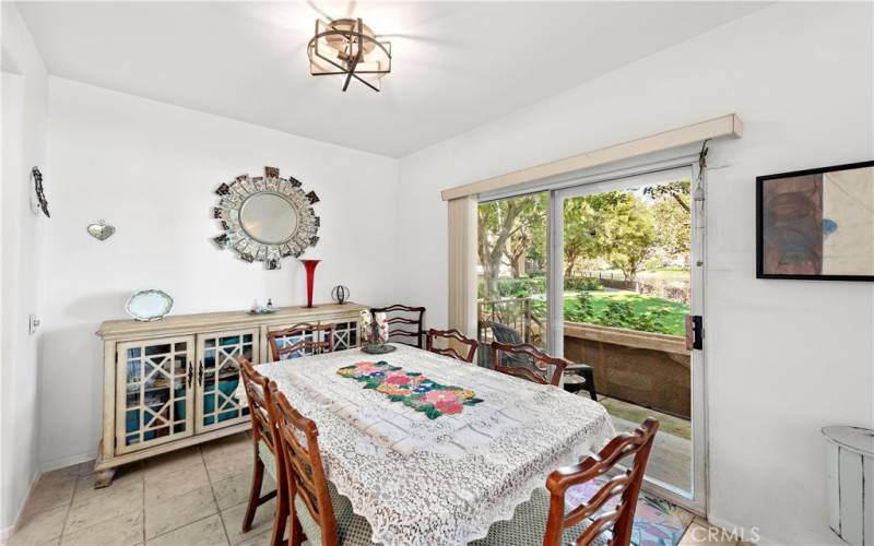 Dining room with large table and sliding door leading to the patio