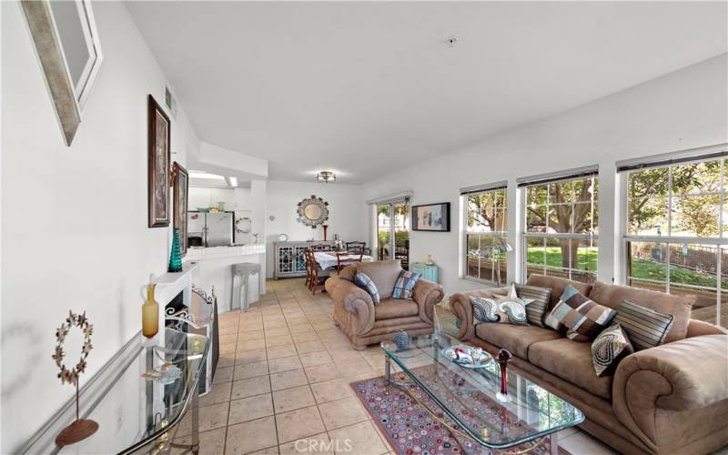 linging room facing the kitchen and dining.  Patio to the right with lake views