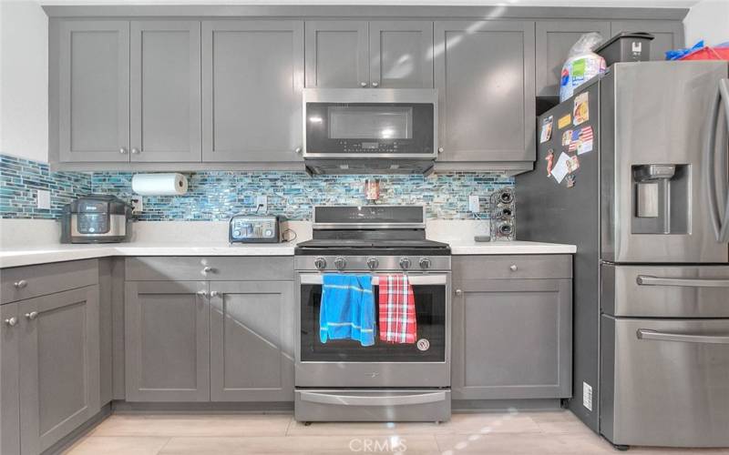 Neutral Gray Cabinetry Throughout...Stainless Appliances.