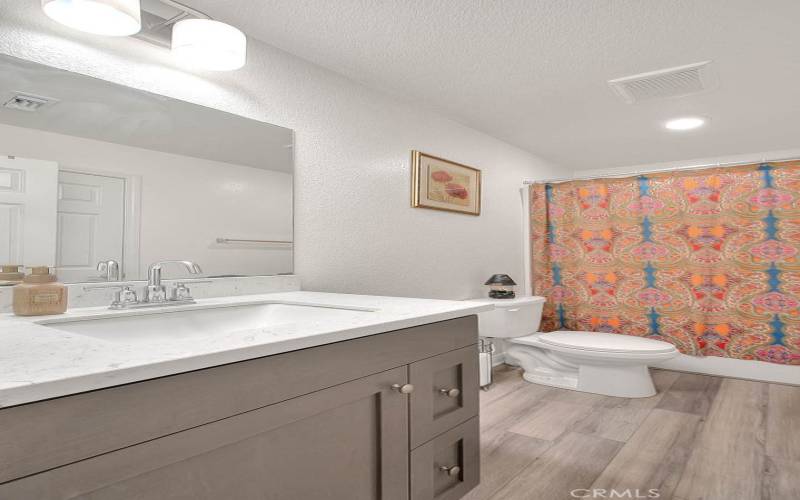 Secondary Bath with Creamy, Upgraded Quartz Counters and Upgraded Faucet!