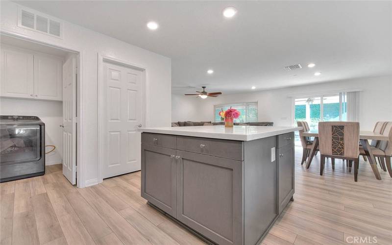 Center Isle View with Storage on three sides, laundry room in photo to left.