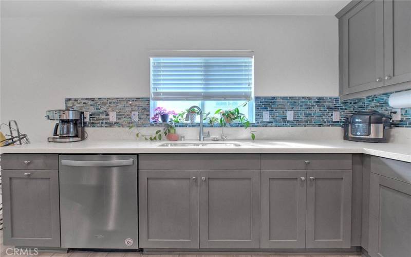 Creamy Quartz Counters and Stunning Backsplash!