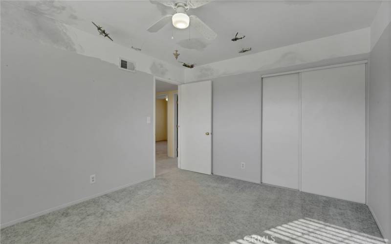 Bedroom 1 with view to hallway