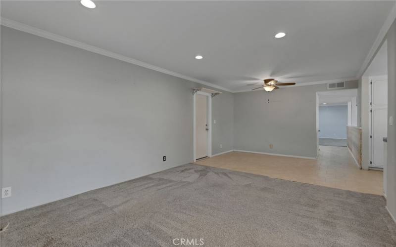 Family room- middle open doorway leads to stairs to upstairs bedrooms.