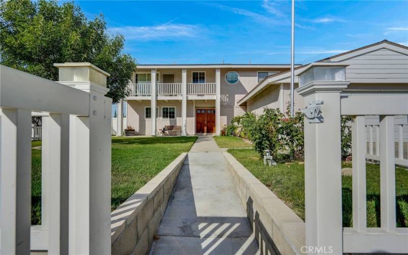 Gated home with newer vinyl fencing