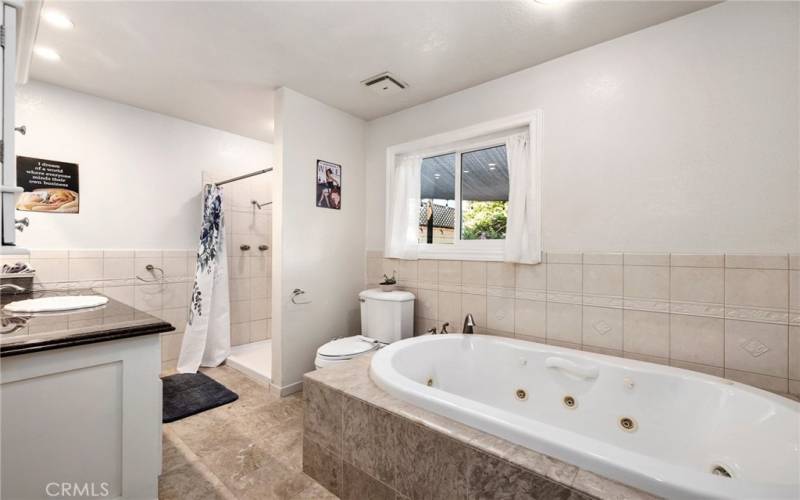 Luxurious bath with oversize jetted tub.