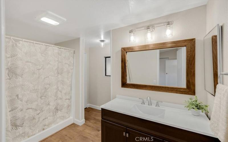 Master bath. Toilet has its own space behind the wall.