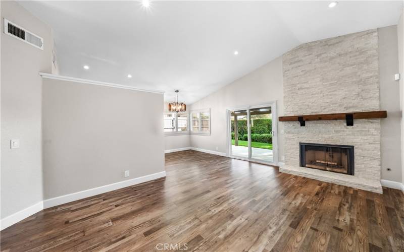 Living room w/ custom fireplace and mantle