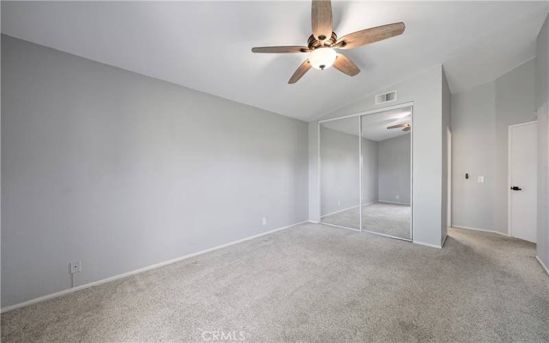 Primary bedroom with ceiling fan