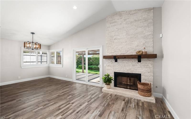 Living room w/ vaulted ceiling