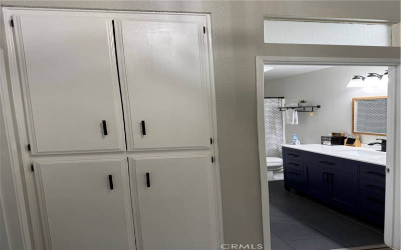 upstairs hallway with storage