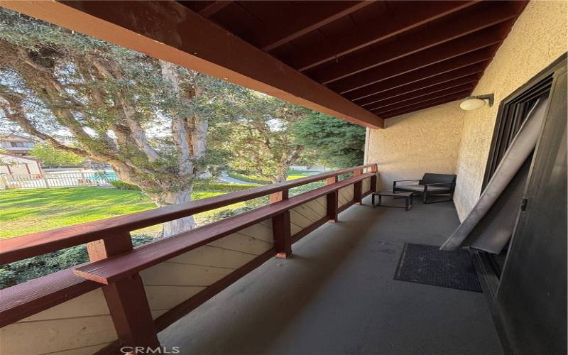 Balcony overlooking pool (shaded)