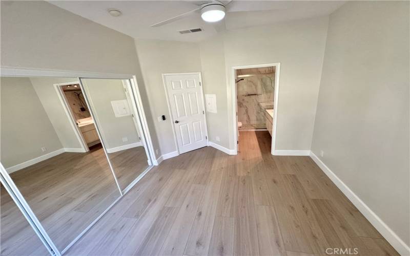 Master bedroom with new floors and new closet doors and new doors