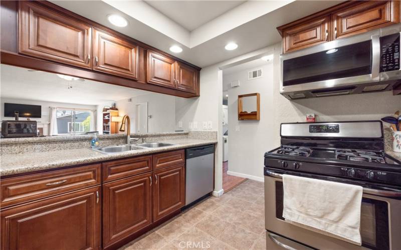 Dishwasher, Stove, Microwave and plenty of cabinets
