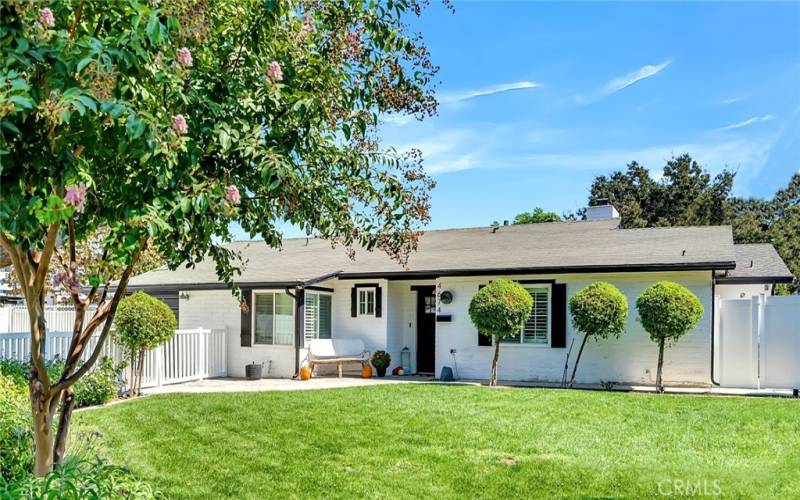 4674 Norton Place in the Wood Streets. Much larger than it looks -- 4 beds, 3 baths, almost 2400 sq ft with RV parking. Front yard is entirely enclosed with vinyl fence with lighting, LED-lit gardens, and a fully programmable sprinkler drip system to keep your lush oasis thriving.