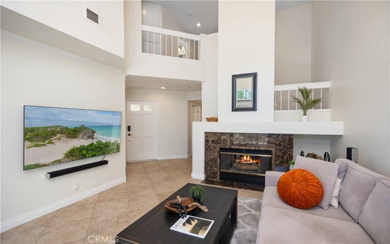 Bright and Open Living Room with Fireplace and Vaulted Ceilings