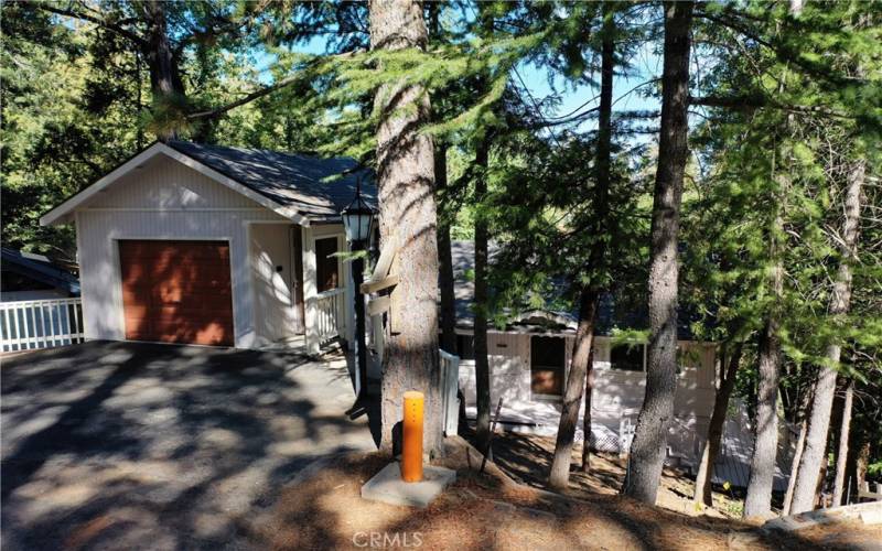 A single-car garage with storage space underneath.