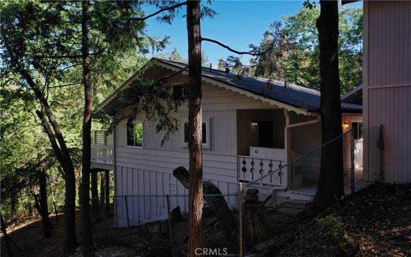 A fenced dog run that is easily accessible from the porch.